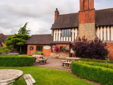 Acton Trussell, UK - Saturday 6th July 2024: Gardens and outside seating at the bar area of the Moat House Hotel. High quality photo clipart