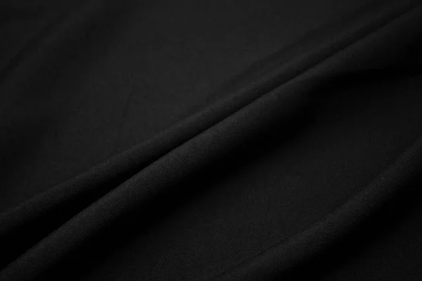 深色黑色面料的纹理特写 低调的照片丛螺纹 服装业 摘要背景 黑色的纺织品波浪黑布背景 — 图库照片