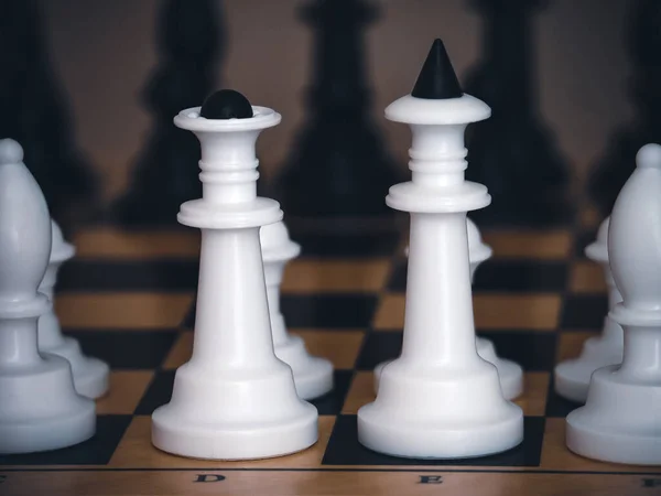stock image Chess game. Chess pieces on the game board. White and black. Tactical competition. Top view. Concept of a successful team work leader. Business strategy.