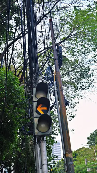 stock image Traffic light showing yellow, caution sign to turn left