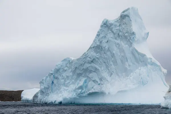 Large pinnacle iceberg drifting in the Antarctic waters