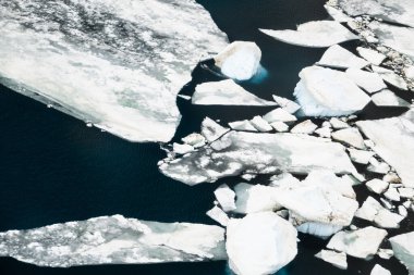 Aerial photograph of the icebergs of different sizes and shapes (from growlers to very large) broken off from the Ross Ice Shelf of Antarctica clipart