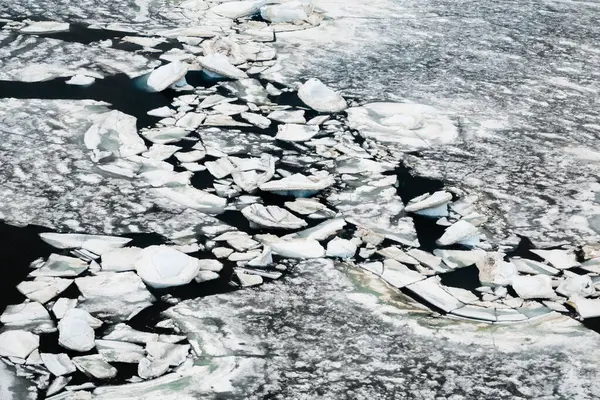 Aerial view of the sea ice breaking off during the summer in Antarctica