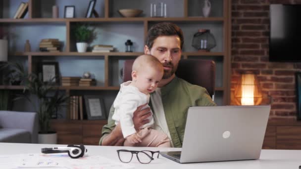 Father Maternity Leave Working Home Office Laptop Small Child His — Vídeo de Stock