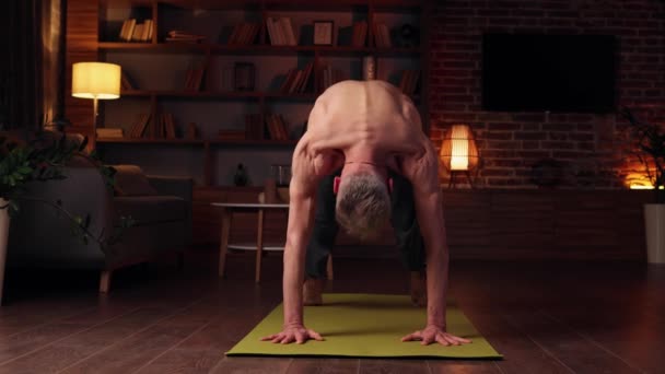 Yoga Home Gray Haired Man Does Yoga Home Doing Asanas — Stockvideo