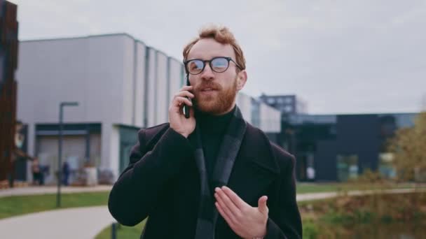Young Red Haired Guy Glasses Backdrop Business Center Stylish Coat — Stock Video