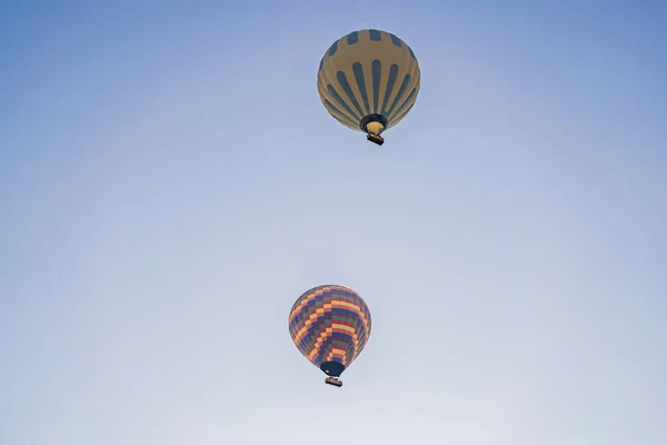 Beautiful hot air balloons over blue sky.