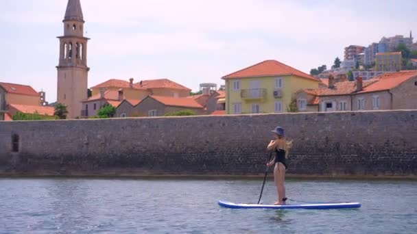 Young Woman Paddling Sup Board Close Walls Old City Budva — Stock Video