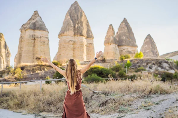 Stock image Woman tourist on background of Unique geological formations in Love Valley in Cappadocia, popular travel destination in Turkey.