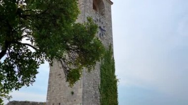 Slowmotion video of clocktower in the ruins of the Bar old city or Stari Grad. A destroyed ancient settlement close to the city of Bar. Travel destinations of Montenegro.