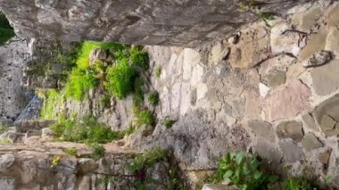 Vertical video. The ruins of the Bar old city or Stari Grad. A destroyed ancient settlement close to the city of Bar. Travel destinations of Montenegro.