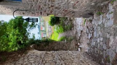Vertical video. The ruins of the Bar old city or Stari Grad. A destroyed ancient settlement close to the city of Bar. Travel destinations of Montenegro.
