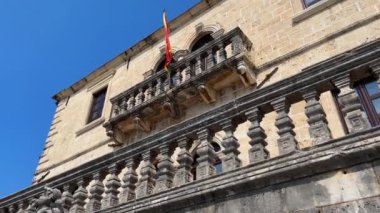 Walking through the charming coastal town of Perast in Montenegro. Strolling along its cobblestone streets lined with historic buildings, including a stunning cathedral with a towering bell tower