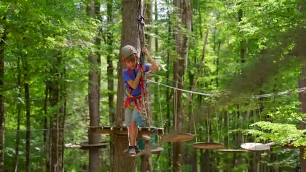 Little Boy Enjoying Exciting Adventure Rope Obstacle Course Lush Forest — Stockvideo