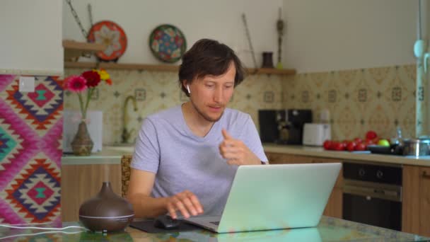 Video Features Young Man Sitting Desk His Apartment Working His — Vídeo de stock