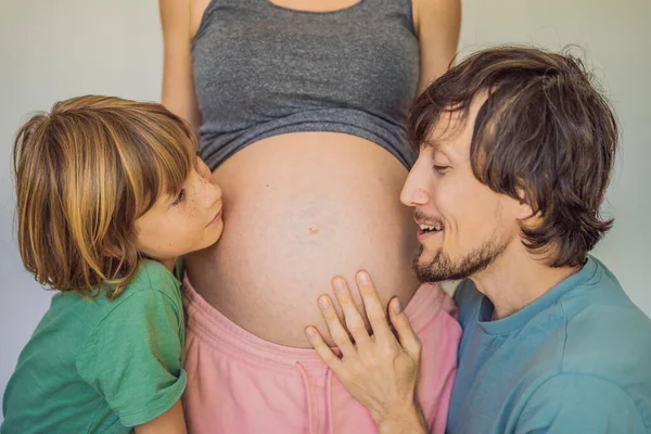 Father Elder Son Listen Moms Pregnant Belly — Stock Photo, Image