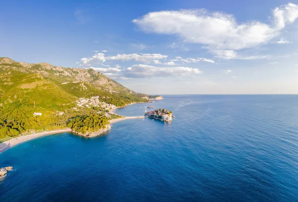 stock image Aerophotography. Aerial view of Sveti Stefan island in a beautiful summer day, Montenegro from flying drone. Panoramic above view of Saint Stephen luxury resort. Tourism and leisure concept.