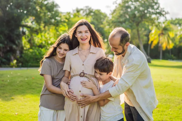 Loving Family Enjoying Leisurely Walk Park Radiant Pregnant Woman Embraced — Stock Photo, Image