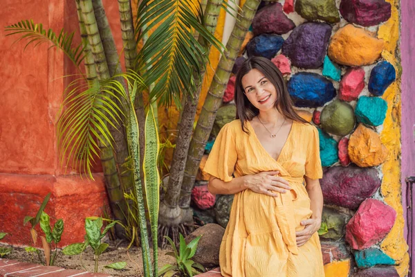 A strong and resilient woman over 40 embraces the beauty of childbirth in Mexico, celebrating the journey of motherhood with cultural richness.