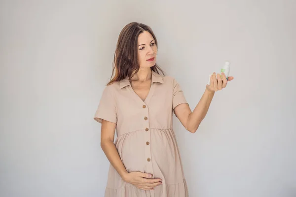 Confident Radiant Pregnant Woman Showcasing Debate Pregnancy Deodorant Good Bad Royalty Free Stock Photos