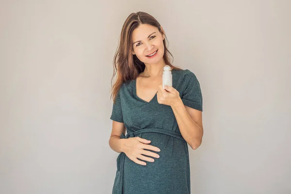 Confident and radiant pregnant woman over 40 showcasing the debate on pregnancy and deodorant. Is it good or bad for expectant mothers. Embrace the journey with safe and gentle options.