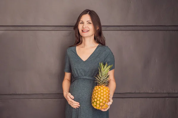 Pregnant Womans Belly Beautifully Showcasing Size Her Baby Likened Pineapple Royalty Free Stock Photos