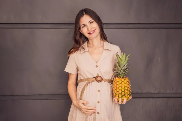 Pregnant Womans Belly Beautifully Showcasing Size Her Baby Likened Pineapple Royalty Free Stock Images