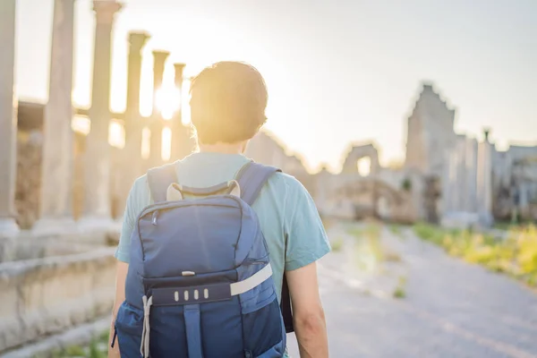 stock image Tourist man at the ruins of ancient city of Perge near Antalya Turkey.