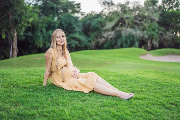Happy Young Pregnant Model Sitting Grass Lawn Looking Setting Sun — Stock Photo, Image