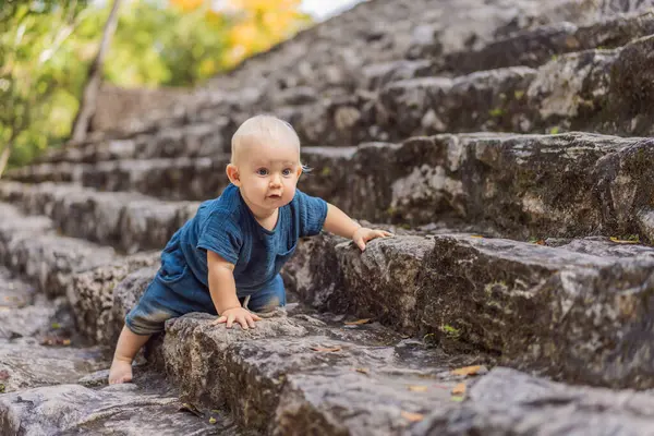 stock image Baby tourist at Coba, Mexico. Ancient mayan city in Mexico. Coba is an archaeological area and a famous landmark of Yucatan Peninsula. Cloudy sky over a pyramid in Mexico.