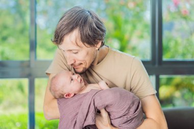 Dad and newborn at home. This tender moment captures the bond between father and child in a loving and comfortable family environment highlighting the joys of parenthood and the warmth of home. clipart