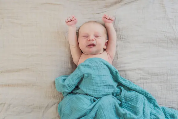 stock image The baby is sleeping peacefully in his cozy nest. Newborn photo session captures the serene innocence and warmth of early moments.