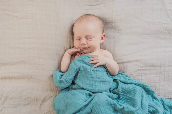 stock image The baby is sleeping peacefully in his cozy nest. Newborn photo session captures the serene innocence and warmth of early moments.