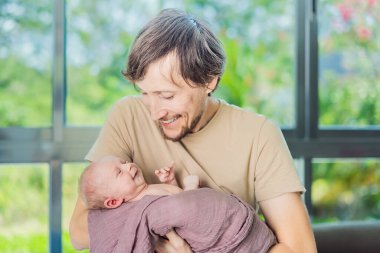 Dad and newborn at home. This tender moment captures the bond between father and child in a loving and comfortable family environment highlighting the joys of parenthood and the warmth of home. clipart