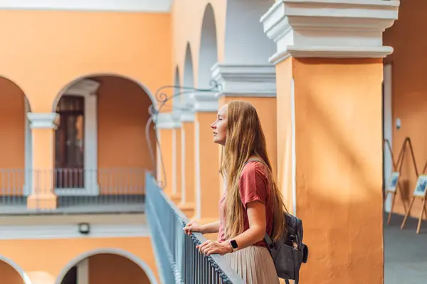 stock image Female tourist in the Biblioteca Palafoxiana Palafoxiana Library, Puebla, Mexico. Cultural exploration, history, and travel experience concept.