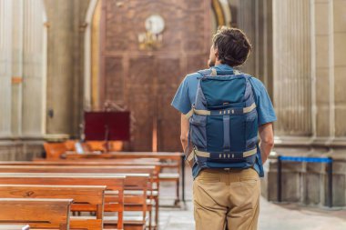 Man tourist exploring the grandeur of Catedral de Puebla, Mexico. Captivating architecture, cultural heritage, and a historic travel experience in one of Mexicos iconic landmarks. clipart