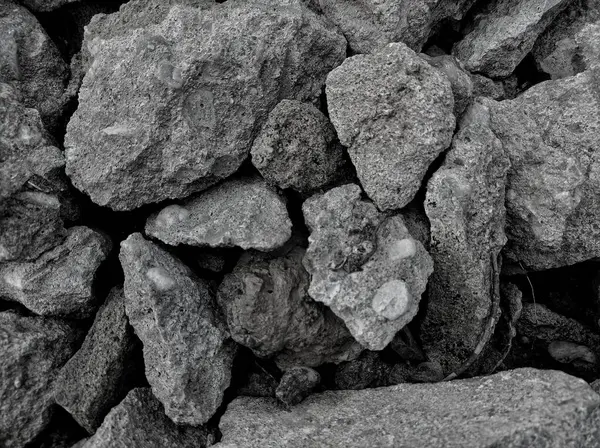 pile of stones on a black and white background