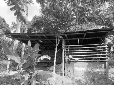 farmer's shelter hut on a black and white background clipart