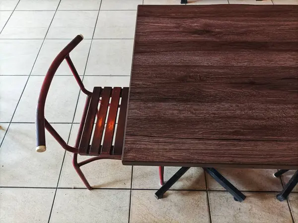 stock image wooden tables and chairs in a cafe