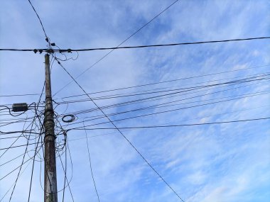 Attractive electric pole on a sunny morning clipart