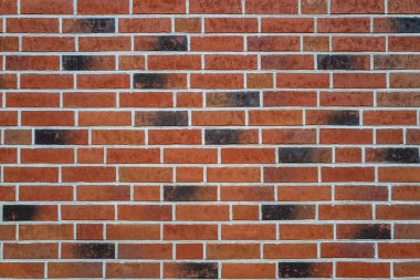 Almanya, Hamburg 'daki tuğla duvarların arkasında. Duvarın ön cephesinde tuğlalar olan mimari arka plan. Taş kaplama duvar arkaplanı. Poster veya afiş için tuğla yüzey arkaplanı