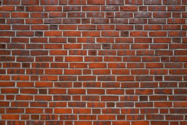 Duvarın arkasında tuğla var. Arka plan için duvar deseni. Tuğla duvarın desenli arka planı. Duvar grunge arkaplanı