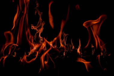 Ateşin dokusu siyah arkaplanda. Şenlik ateşi. Siyah arka planda ateş dokusu. Siyah arka planda yangın. Siyah arkaplanda yangın