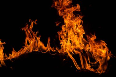 Sancak arka planı için ateş dokusu. Yangın lambaları yanıyor. Alev alev yanıyor. Arkaplanı alevler kaplıyor