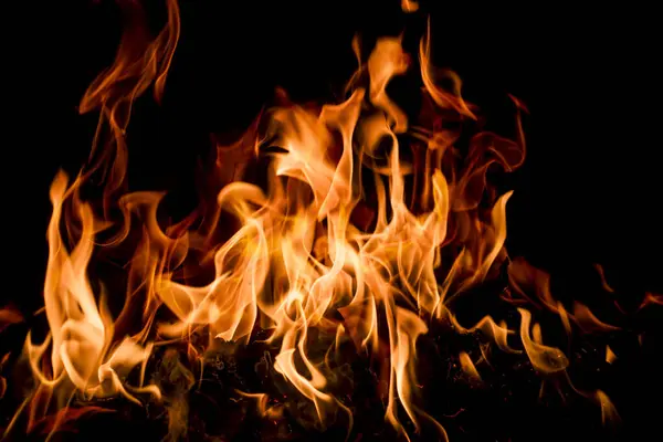 Alev alev desenli arka plan. Yangın arka plan kıvılcımları. Sancak arkaplanı için soyut alev dokusu. Ateş alev dokusu