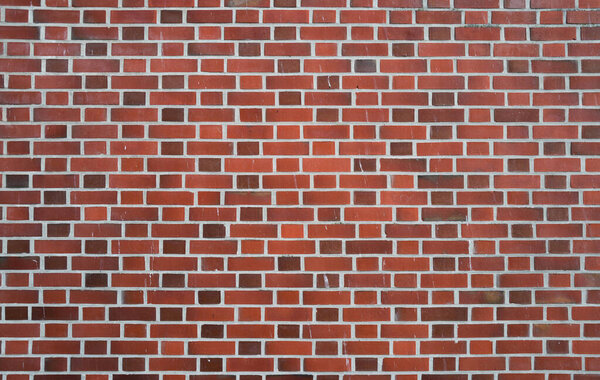 Pavement road. Background of bricks road. Stone cladding pavement. Brick surface background. Rough brick road. Cobblestone pavement background. Textured background. Sidewalk. Old cobblestone road