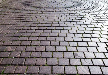 Çakıl taşının arka planı. Taş kaplama yolu olan bir mimari geçmişi var. Beton döşeme arka planı. Poster veya afiş için taş yol arkaplanı