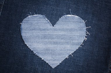 Kumaşlı arka plan için kot pantolon deseni. Denim kot kumaşı. Yırtık kot mu, kot pantolon mu? Reklam için boş alan. Reklam konsepti. Sezon satışları