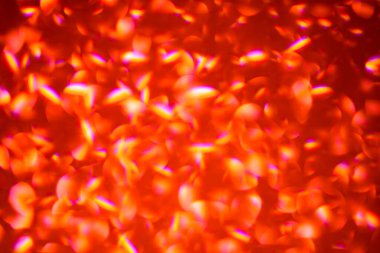 Kırmızı bokeh arka planı. Renkli parıltı soyut Noel 'i aydınlatıyor. Bokeh geçmişi. Tatil geçmişleri. Kopyalama alanı olan soyut arkaplan. Kırmızı Bokeh arkaplanı