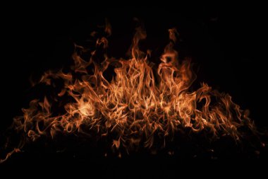 Yangın arka plan kıvılcımları. Soyut alevler arka planı. Yanan ateş. Siyah arka planda ateş dokusu. Reklam için kopyalama alanı olan alevi ateşle